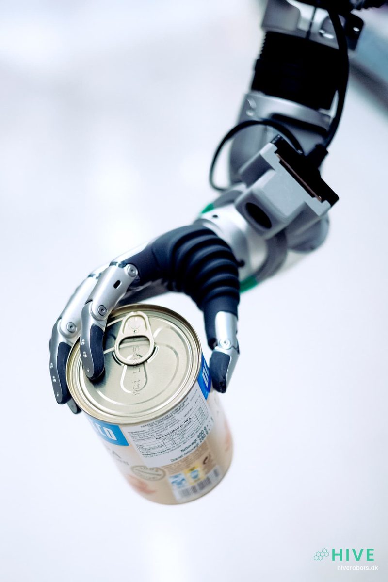 Robot hand holding a tinned product