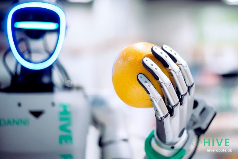 Robot hand holding fruit